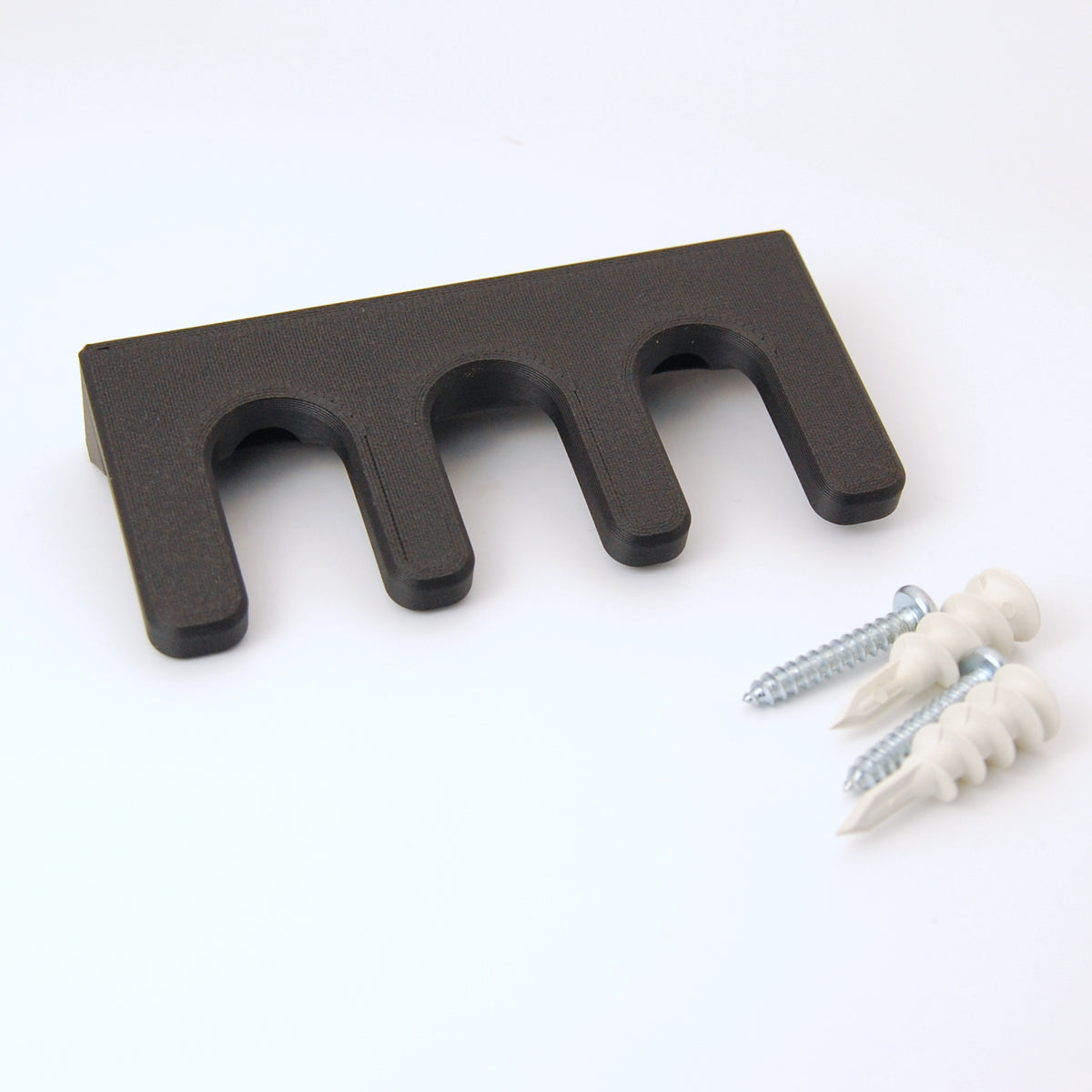 3 slot razor garden on a white background with two drywall anchors and screws.