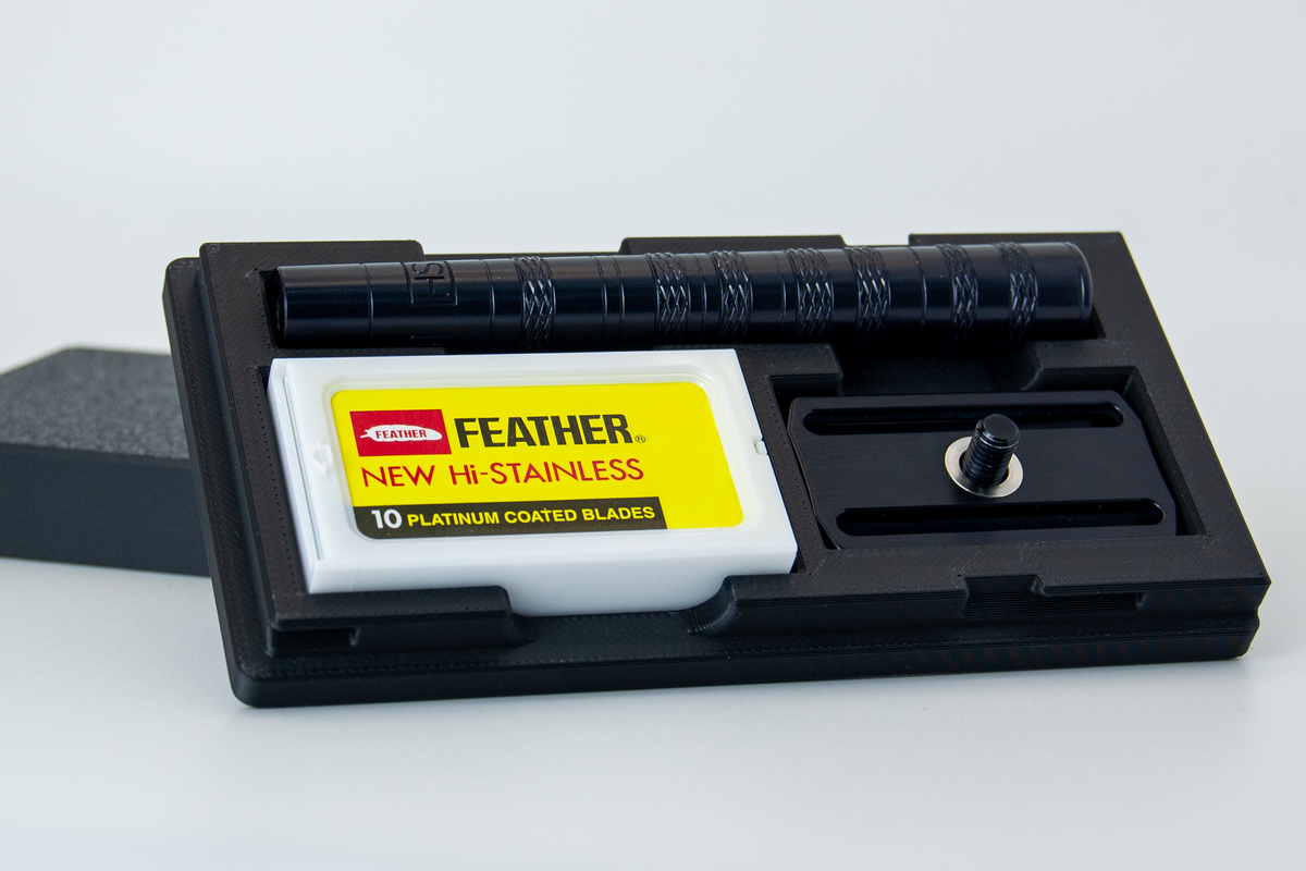 Closeup view of the Henson Razor travel case in black.