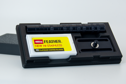 Closeup view of the Henson Razor travel case in black.