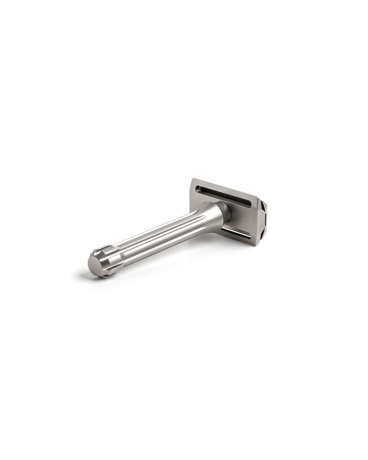 Blackbird Titanium double-edge safety razor with fluted handle and matte silver finish, angled view on white background