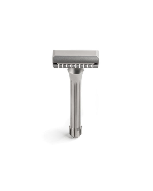 Blackbird Titanium double-edge safety razor with matte silver finish, fluted handle, and scalloped open-comb head