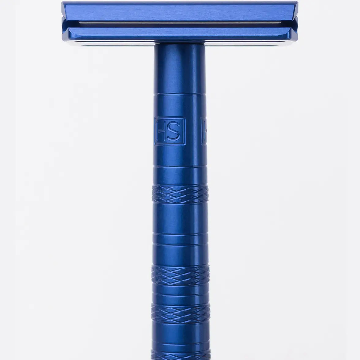 Blue anodized aluminum Henson AL13 double-edge safety razor, close-up showing HS logo and knurled grip on handle