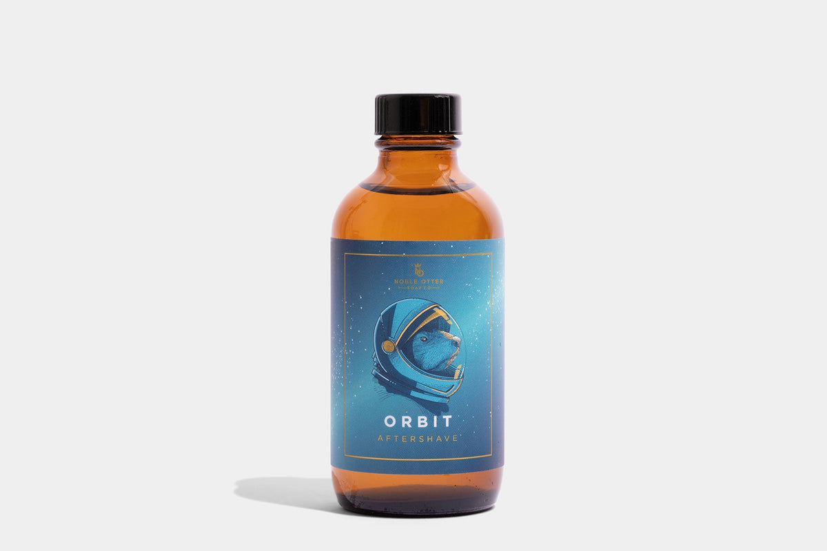 Bottle of Orbit aftershave with a blue label on a white background