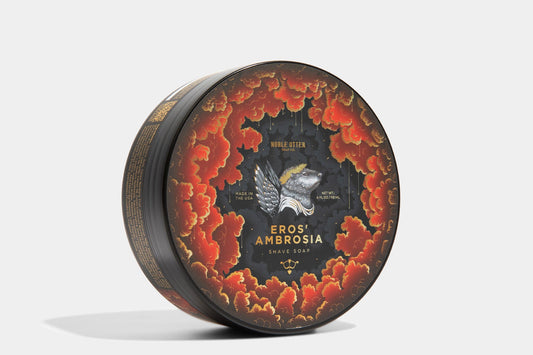 Decorative shave soap container with 'Eros Ambrosia' branding on a white background
