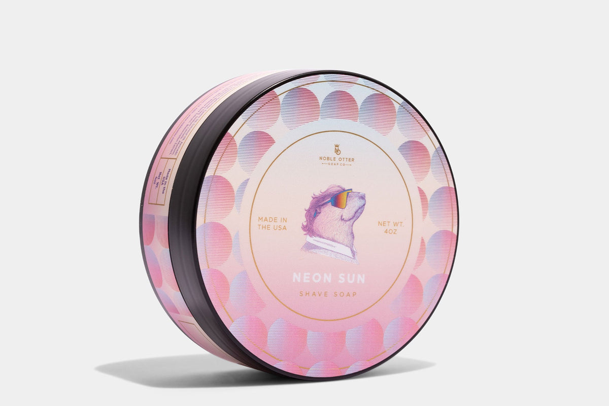 Noble Otter Shave Soap "Neon Sun" with a pink decorative label  on a white background.