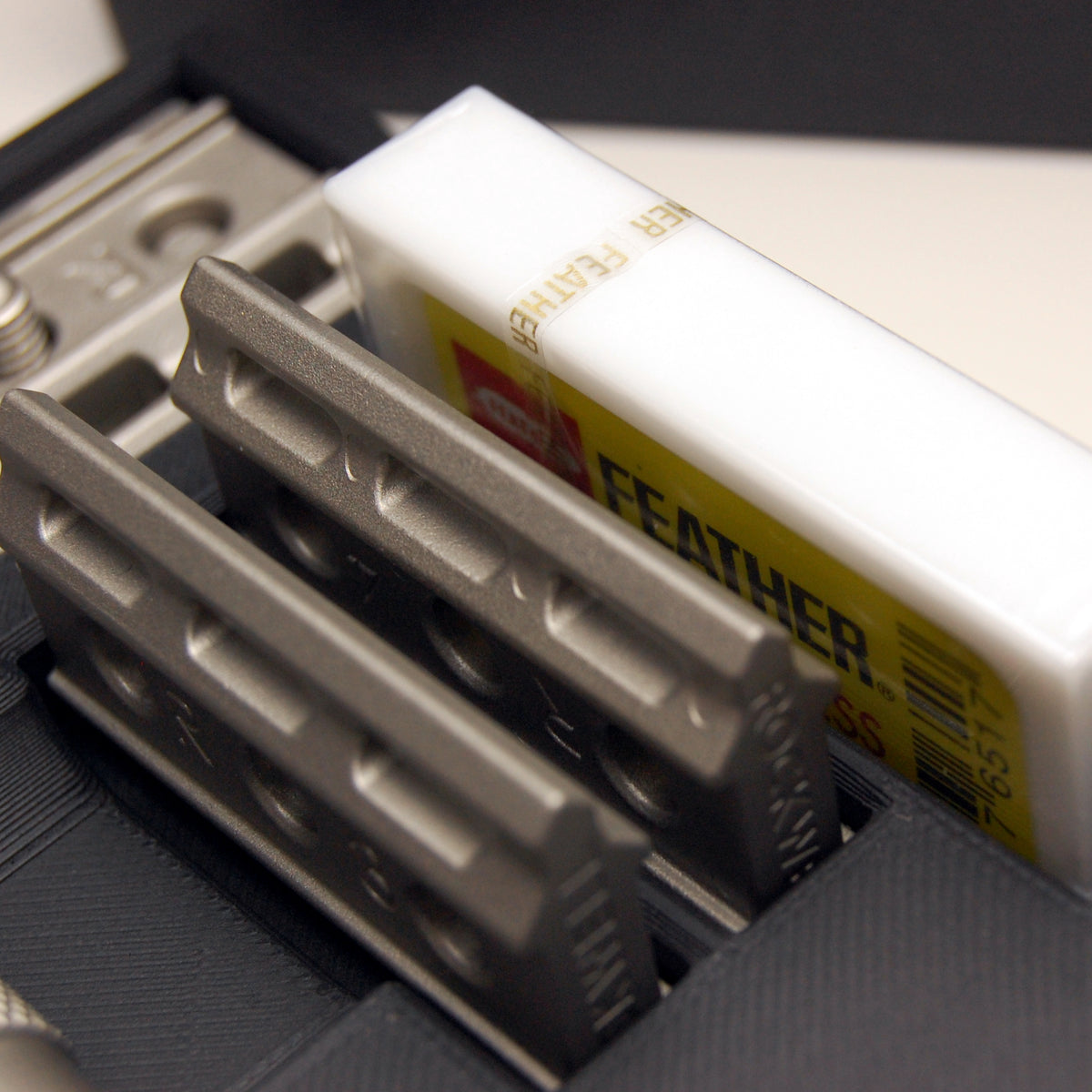 Rockwell Travel Case open, showing a large 10-pack razor blade box like Feather blades in its plastic case fitting inside.