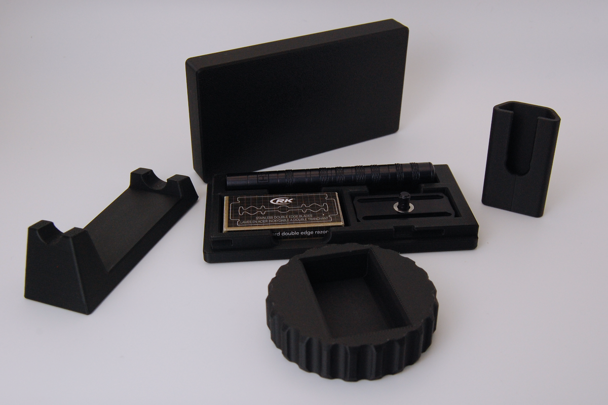 Henson razor bundle in black on a white background.  Includes Henson Case, Henson Cover, razor stand, razor refueler. Razor not included.
