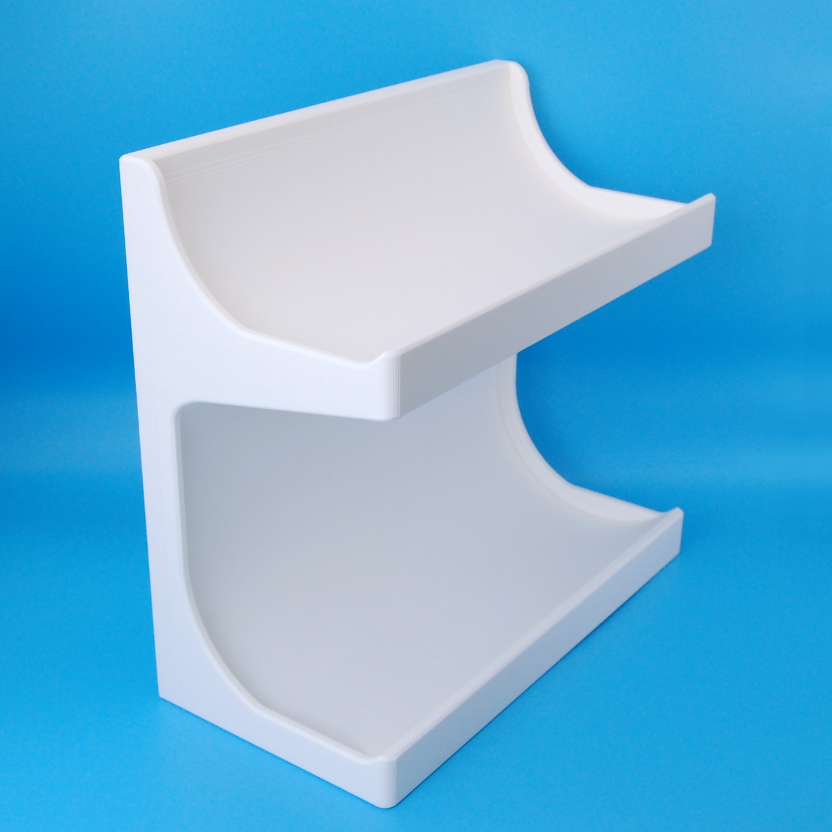 White shaving soap stand on a blue background.