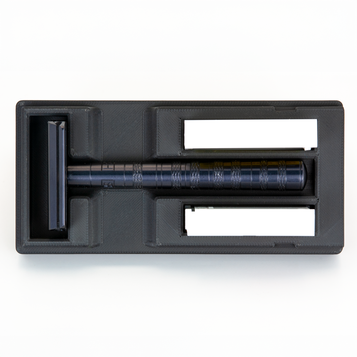 Black Universal Razor Travel Case from above with a Jet Black Henson AL13 seated in it and two blade boxes alongside