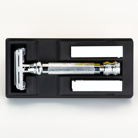 Black Universal Razor Travel Case from above with a chrome Merkur 23C seated in it and two blade boxes alongside